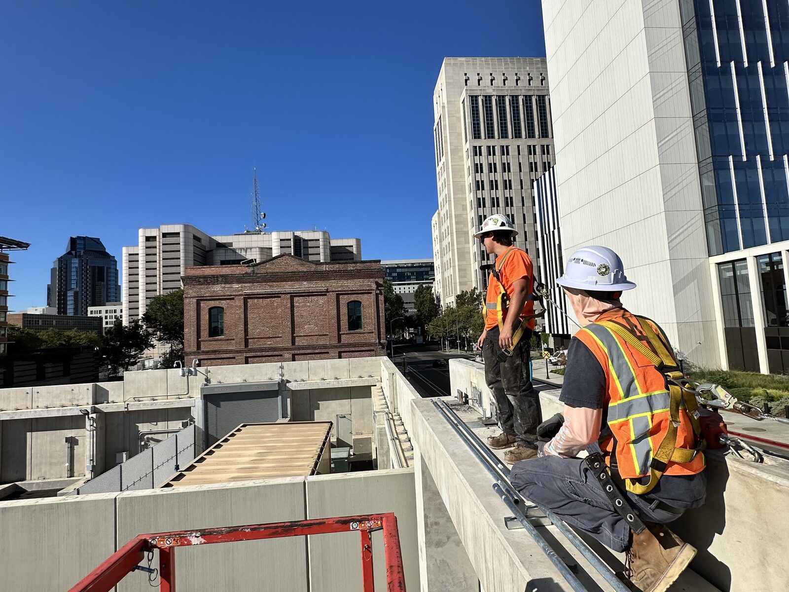 Fusion Electric crew working on a concrete deck at a downtown job site